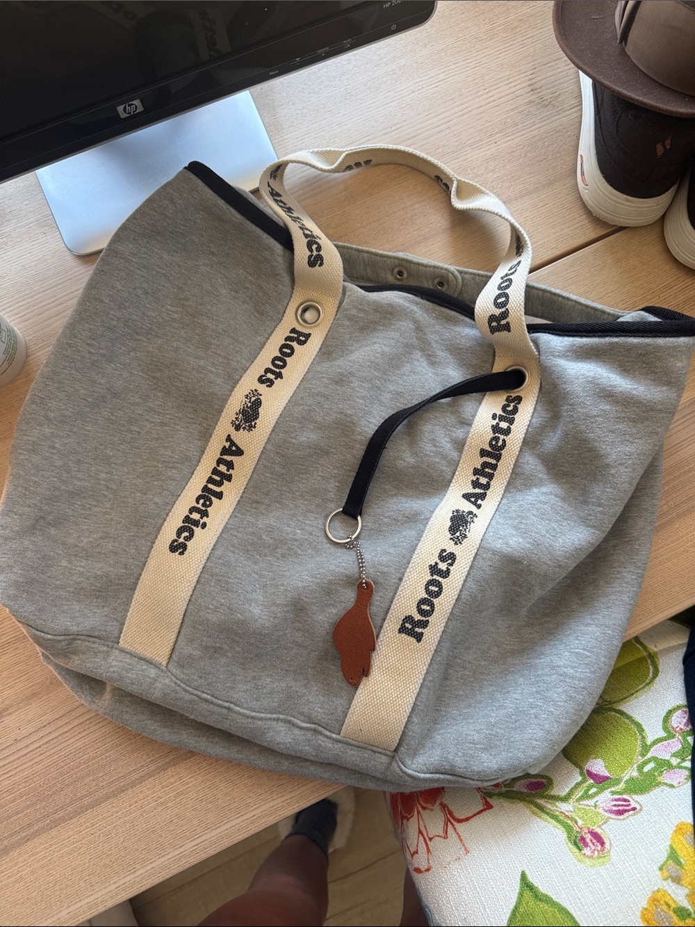 Roots Grey Canvas Tote with Cream Logo Straps and Brown Charm